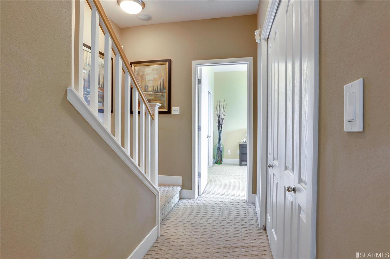 6010 Old Quarry Loop Oakland, CA 94605 - Photo 19 of 32 a view of a hallway with wooden floor and staircase