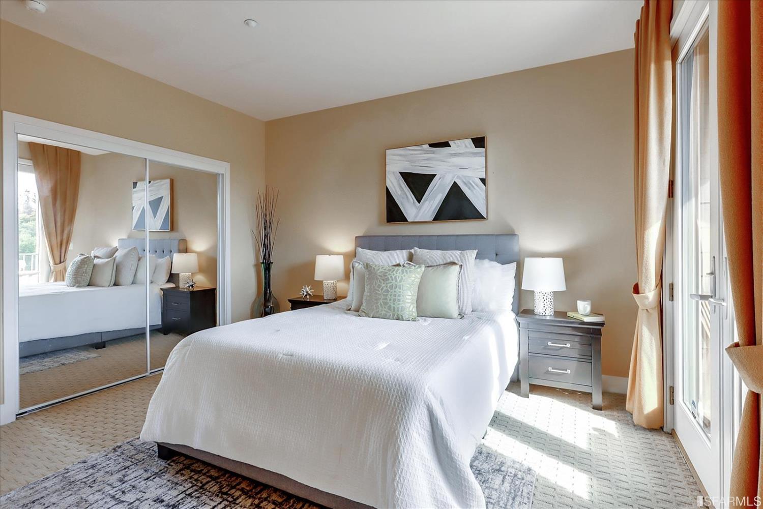 6010 Old Quarry Loop Oakland, CA 94605 - Photo 25 of 32 a bedroom with a bed and a large mirror on the dresser