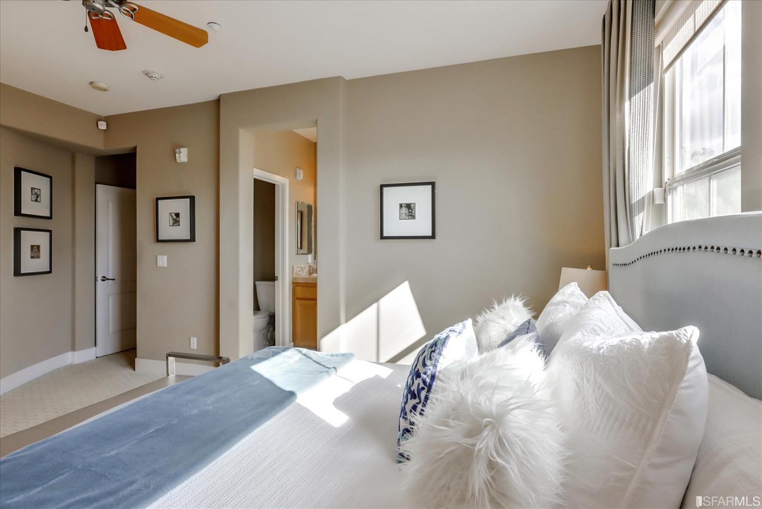 6010 Old Quarry Loop Oakland, CA 94605 - Photo 27 of 32 a bed sitting in a bedroom next to a window