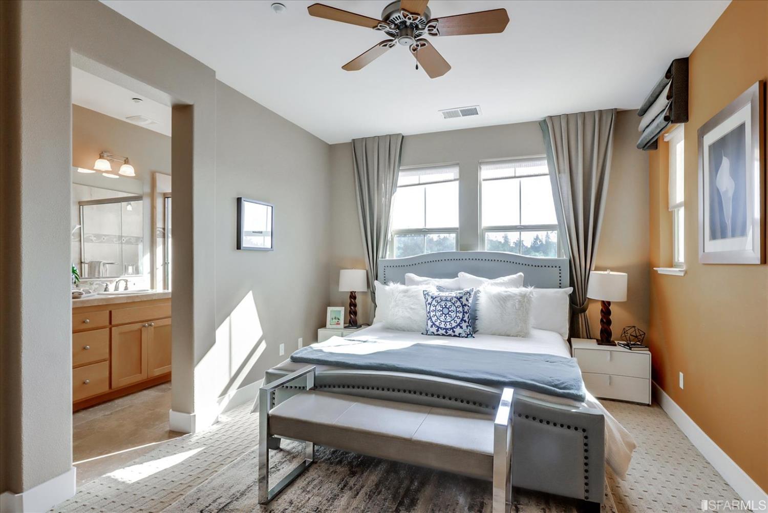 6010 Old Quarry Loop Oakland, CA 94605 - Photo 28 of 32 a bedroom with a bed and large windows