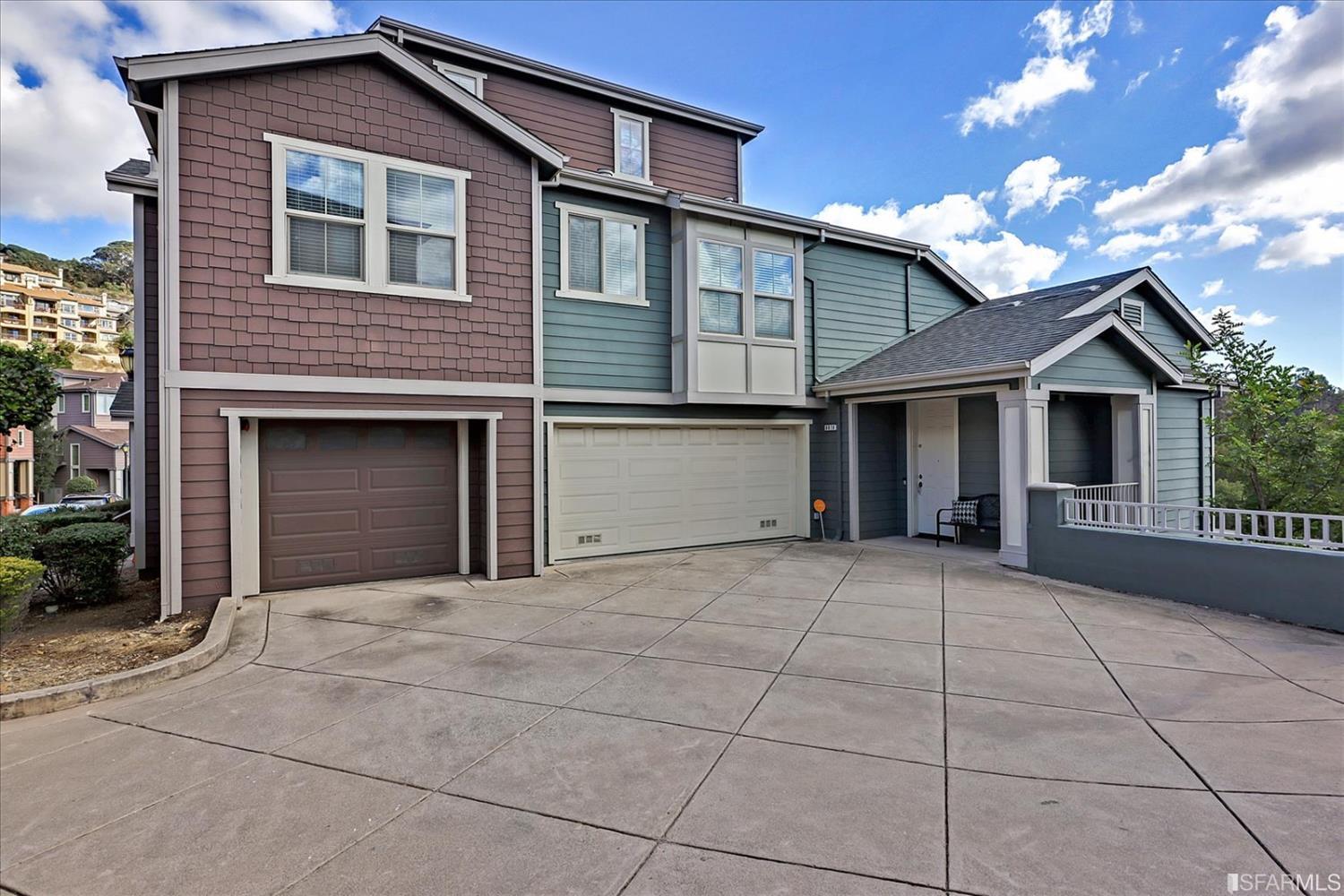 6010 Old Quarry Loop Oakland, CA 94605 - Photo 4 of 32 a front view of a house with yard and garage