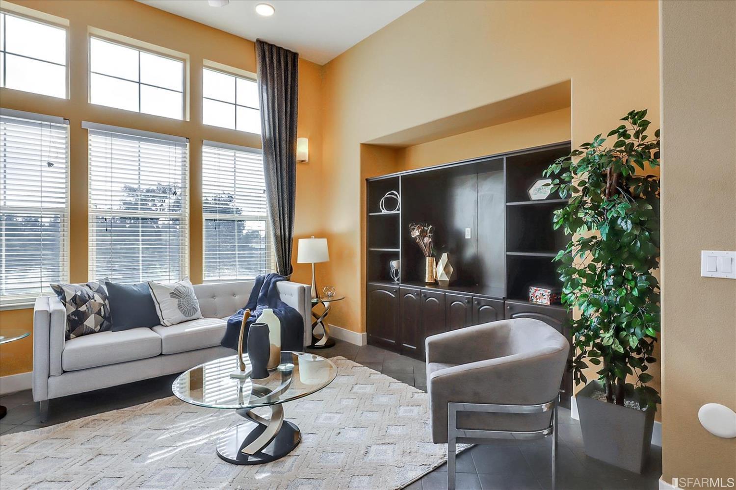 6010 Old Quarry Loop Oakland, CA 94605 - Photo 7 of 32 a living room filled with furniture and a potted plant