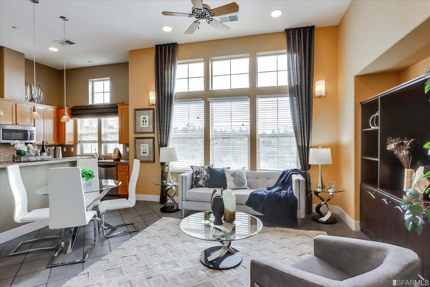 6010 Old Quarry Loop Oakland, CA 94605 - Photo 8 of 32 a living room with furniture flat screen tv and large window