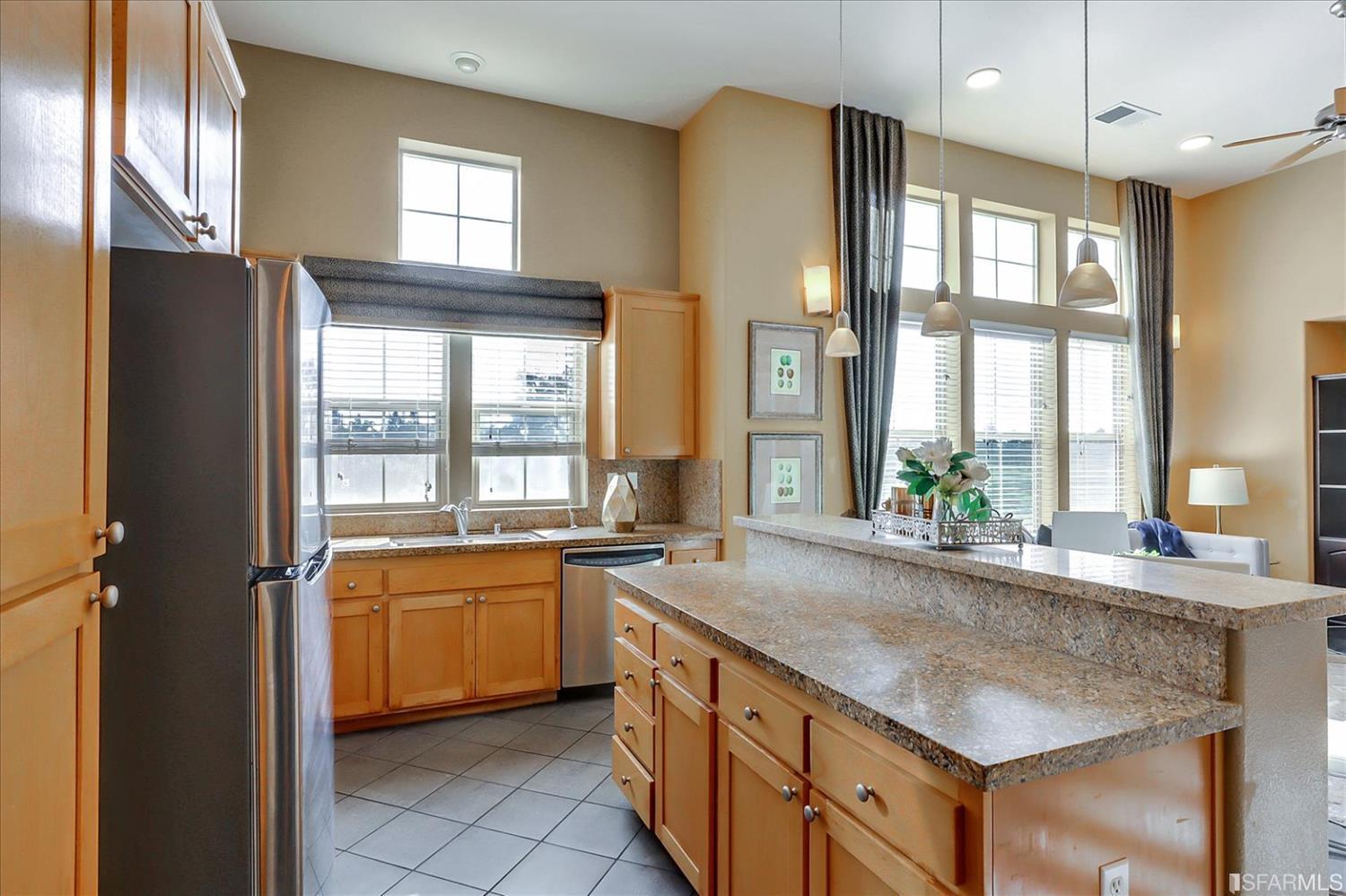 6010 Old Quarry Loop Oakland, CA 94605 - Photo 10 of 32 a kitchen with a sink stove and cabinets