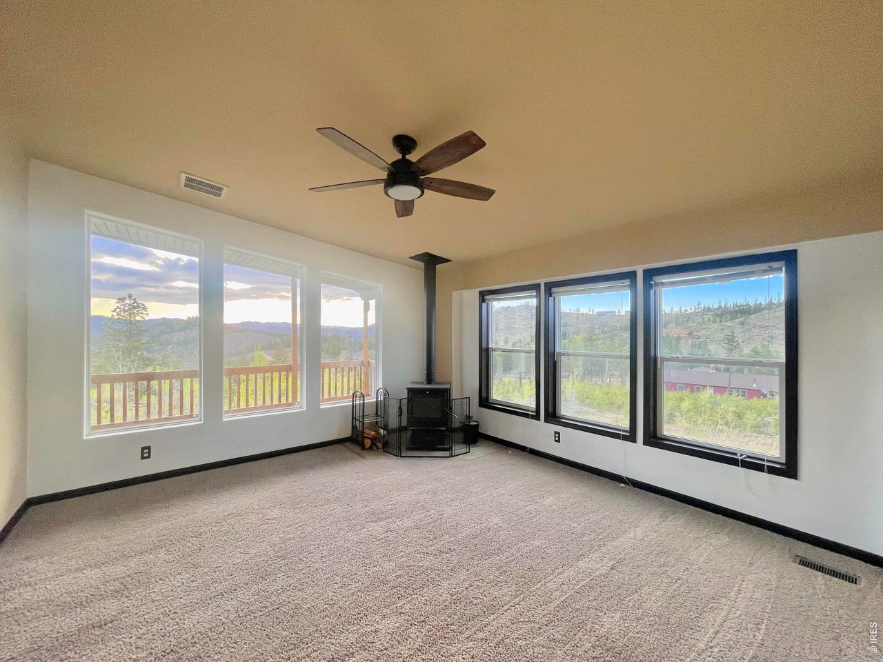 892 Stratton Park Road Bellvue, CO 80512 - Photo 6 of 27 a view of an empty room with a window