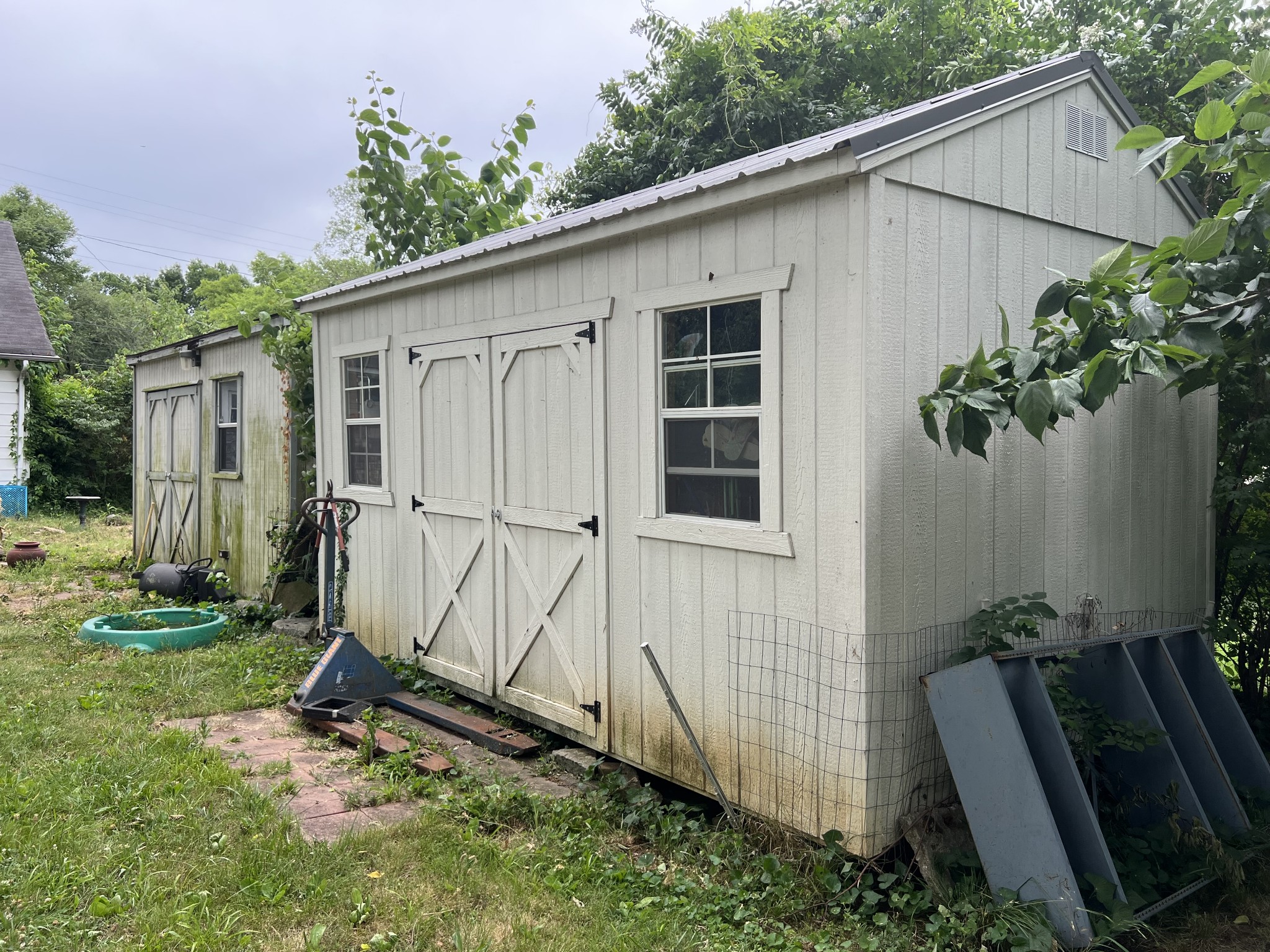 104 Lanier Drive Madison, TN 37115 - Photo 6 of 20 a backyard with potted plants and a wooden fence