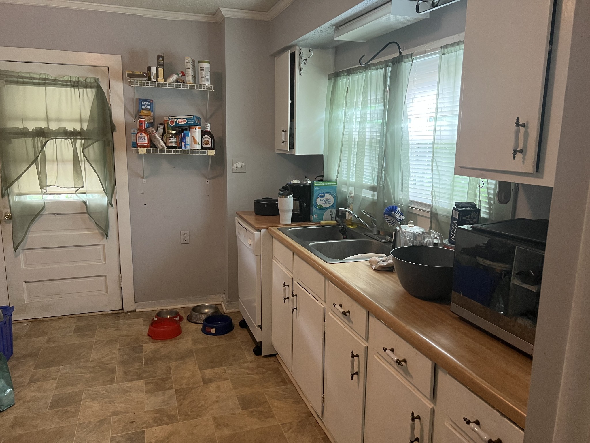 104 Lanier Drive Madison, TN 37115 - Photo 10 of 20 a kitchen with a sink stove and cabinets