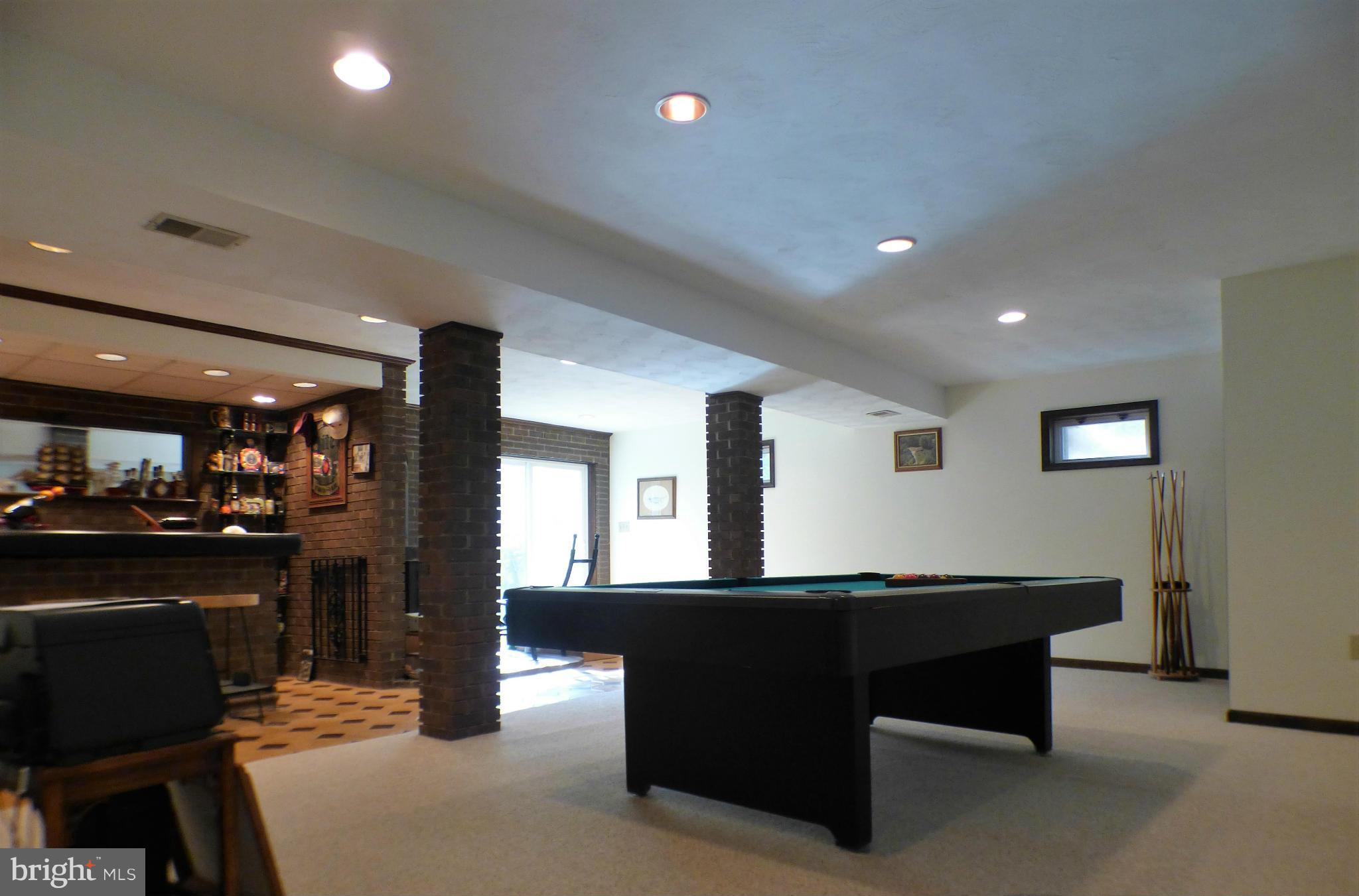 1521 Stinnett Road Huntingtown, MD 20639 - Photo 11 of 30 a living room with kitchen furniture and kitchen view