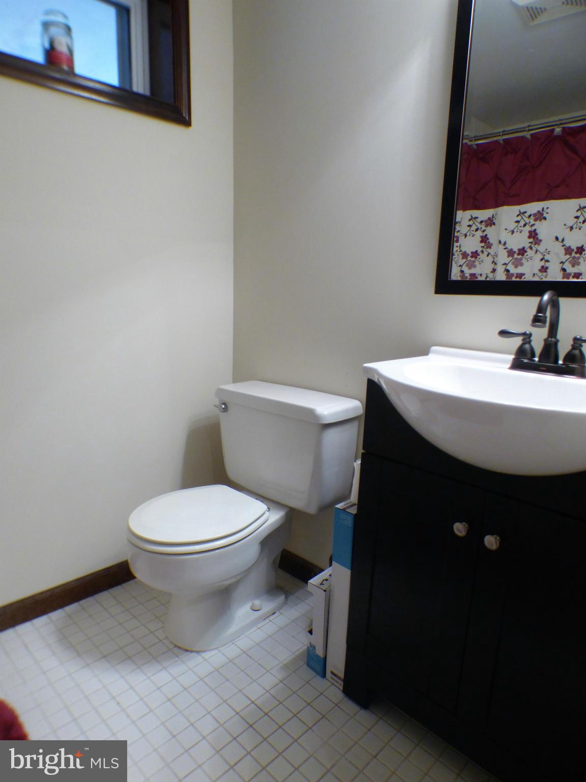 1521 Stinnett Road Huntingtown, MD 20639 - Photo 14 of 30 a bathroom with a sink and a toilet