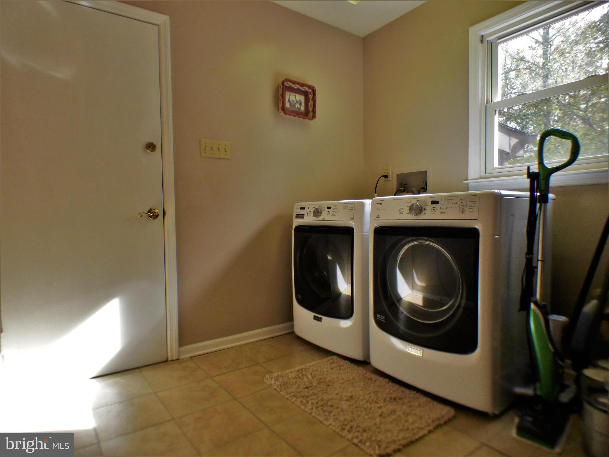 1521 Stinnett Road Huntingtown, MD 20639 - Photo 16 of 30 a utility room with dryer and washer