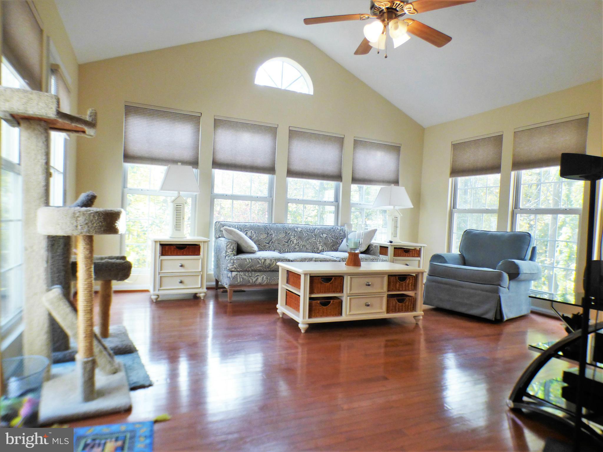 1521 Stinnett Road Huntingtown, MD 20639 - Photo 9 of 30 a living room with furniture and a large window