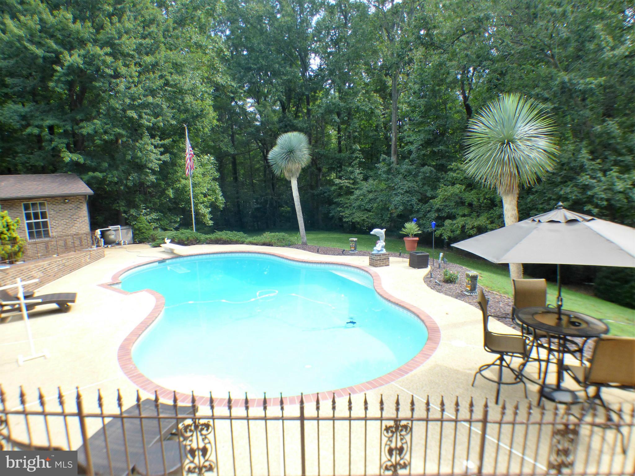 1521 Stinnett Road Huntingtown, MD 20639 - Photo 10 of 30 a view of a swimming pool with a patio
