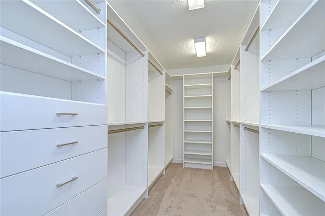 a bathroom with a granite countertop sink mirror and shower
