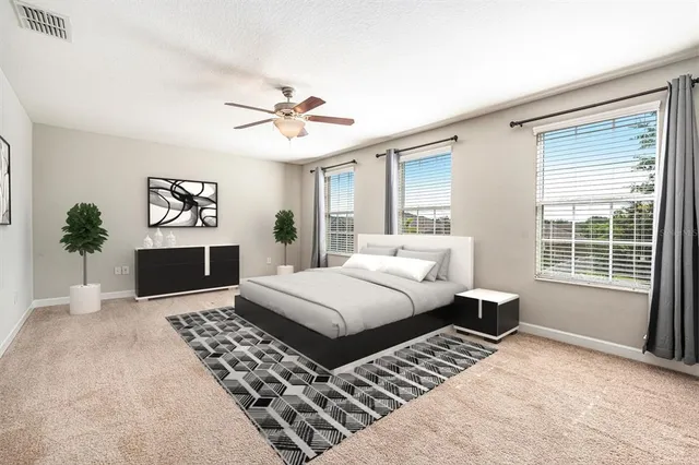 a bathroom with a granite countertop sink a mirror and a shower