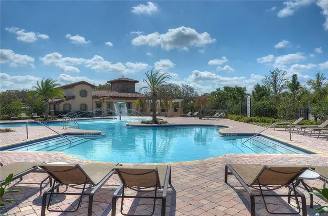 a view of a patio with swimming pool