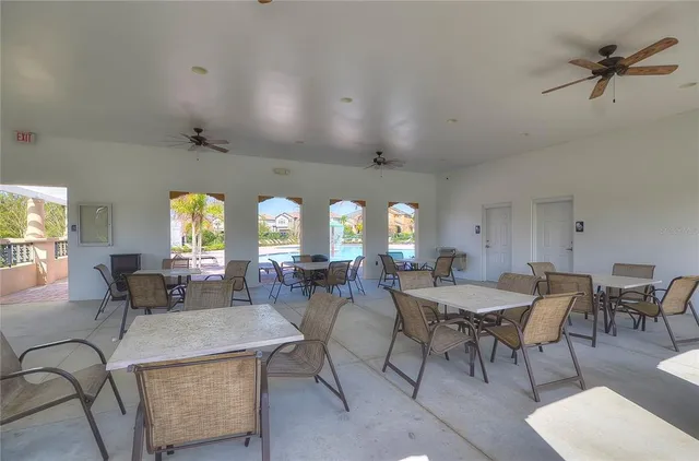 an aerial view of a house with a yard and outdoor seating