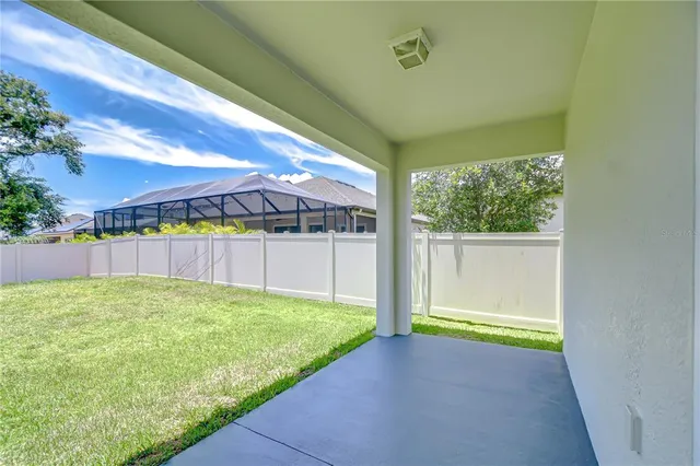 a view of backyard with a garden and plants