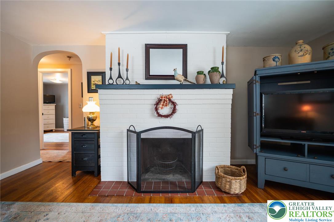 100 Ridge Road Phillipsburg, NJ 08865 - Photo 17 of 40 a living room with furniture a flat screen tv and a fireplace