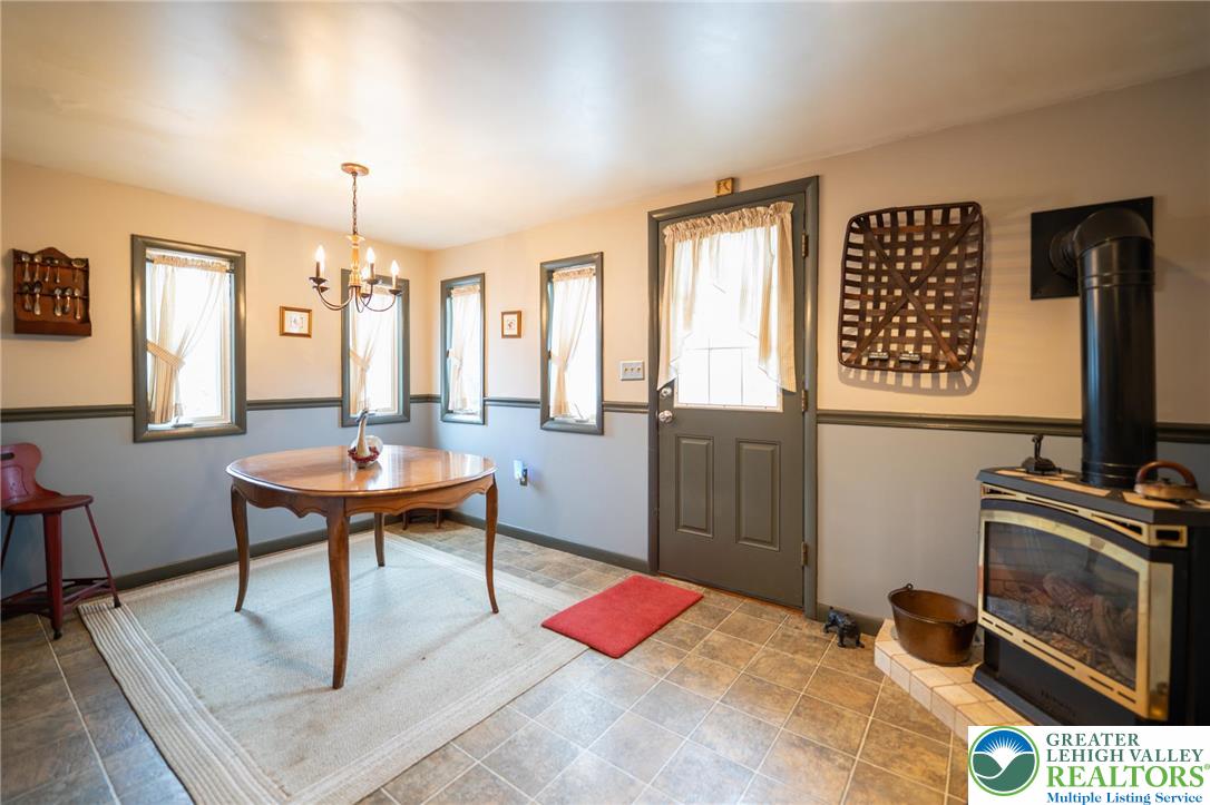 100 Ridge Road Phillipsburg, NJ 08865 - Photo 20 of 40 a living room with furniture a fireplace and a flat screen tv