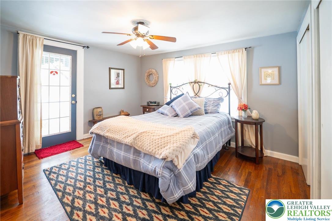 100 Ridge Road Phillipsburg, NJ 08865 - Photo 31 of 40 a bedroom with a bed and wooden floor