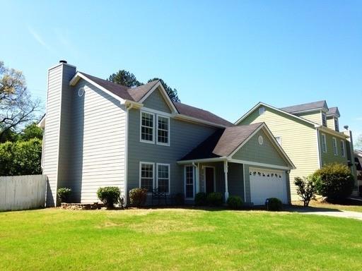 979 Leeds Castle Way Marietta, GA 30066 - Photo 1 of 1 a view of a house with a yard and deck