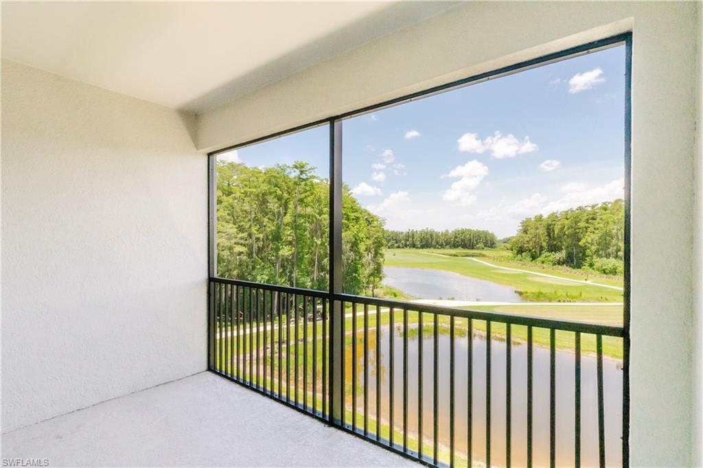 6034 National Boulevard, Unit 544 Ave Maria, FL 34142 - Photo 13 of 48 a view of balcony with floor to ceiling windows with wooden floor