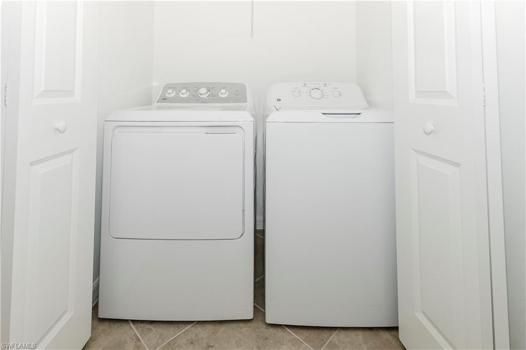 6034 National Boulevard, Unit 544 Ave Maria, FL 34142 - Photo 14 of 48 a utility room with dryer and washer