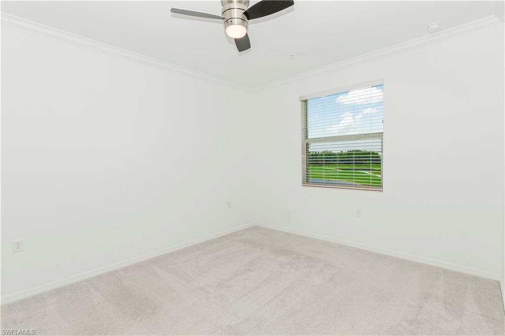 6034 National Boulevard, Unit 544 Ave Maria, FL 34142 - Photo 6 of 48 an empty room with a window