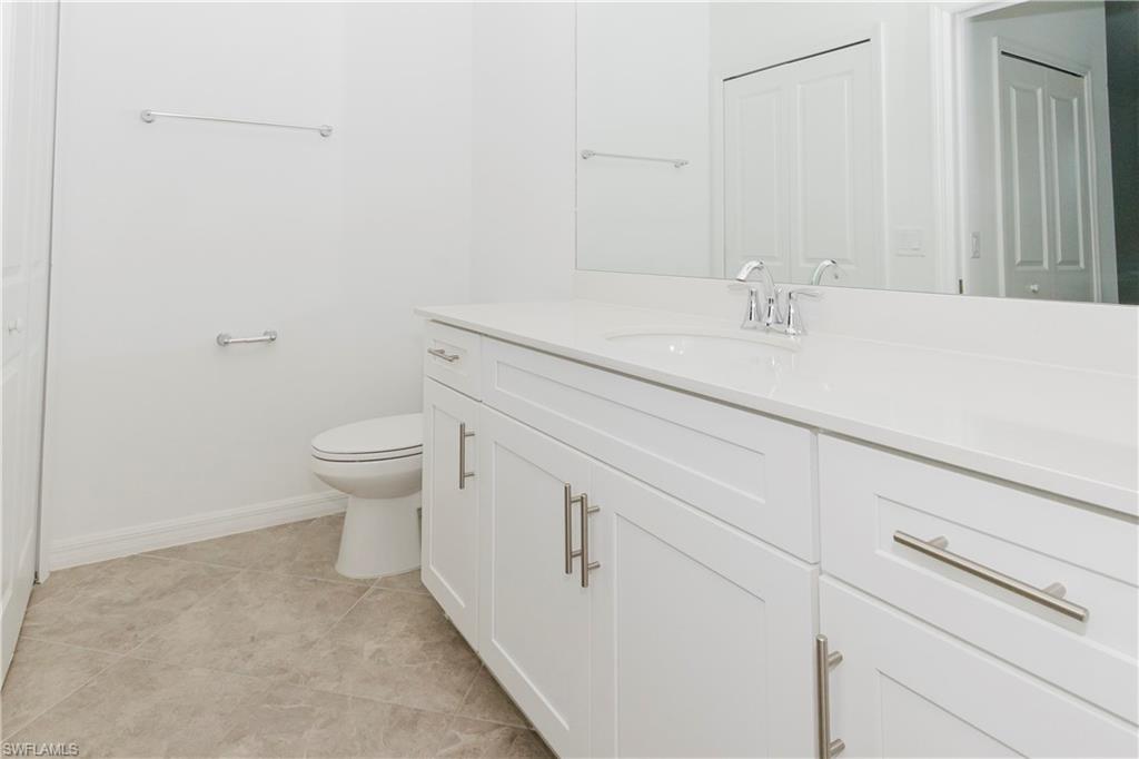 6034 National Boulevard, Unit 544 Ave Maria, FL 34142 - Photo 8 of 48 a bathroom with a sink and a toilet