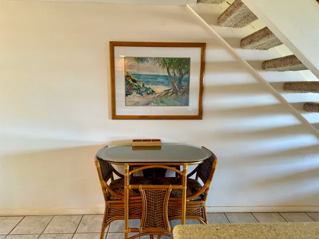 a dining room with a table and chairs