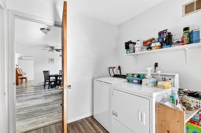 a utility room with sink dryer and washer