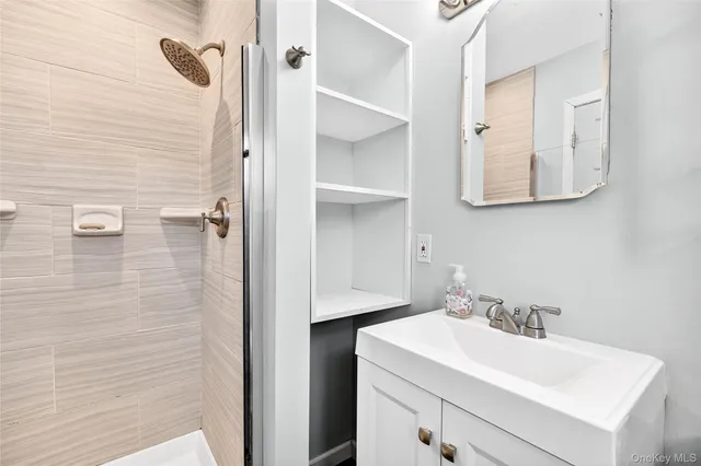 a bathroom with a sink and mirror