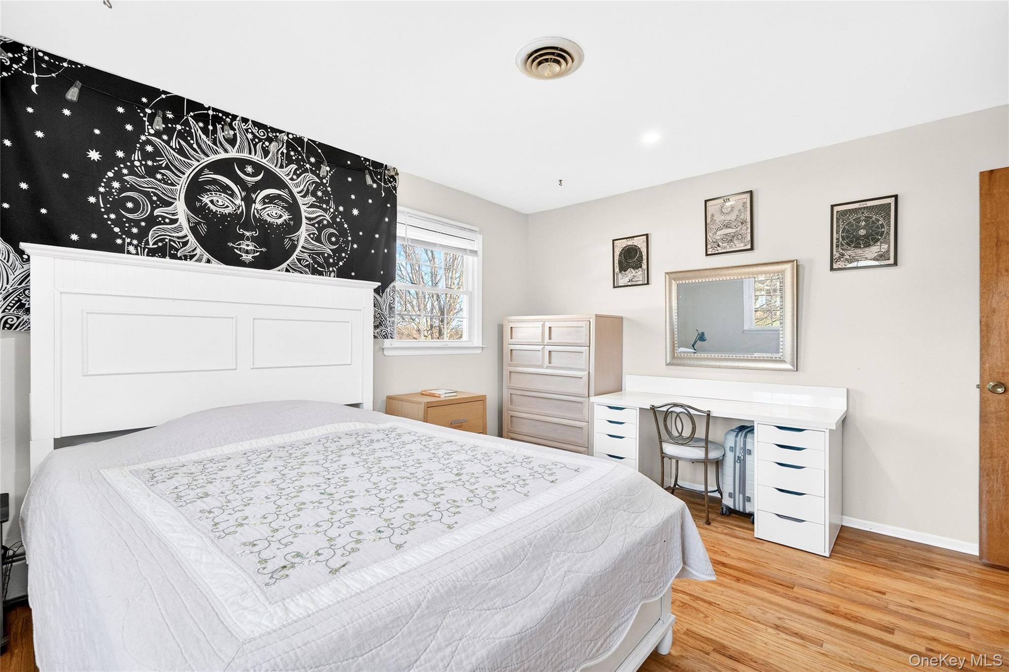 7 O Sullivan Lane Monroe, NY 10950 - Photo 27 of 43 a bedroom with a bed and wooden floor