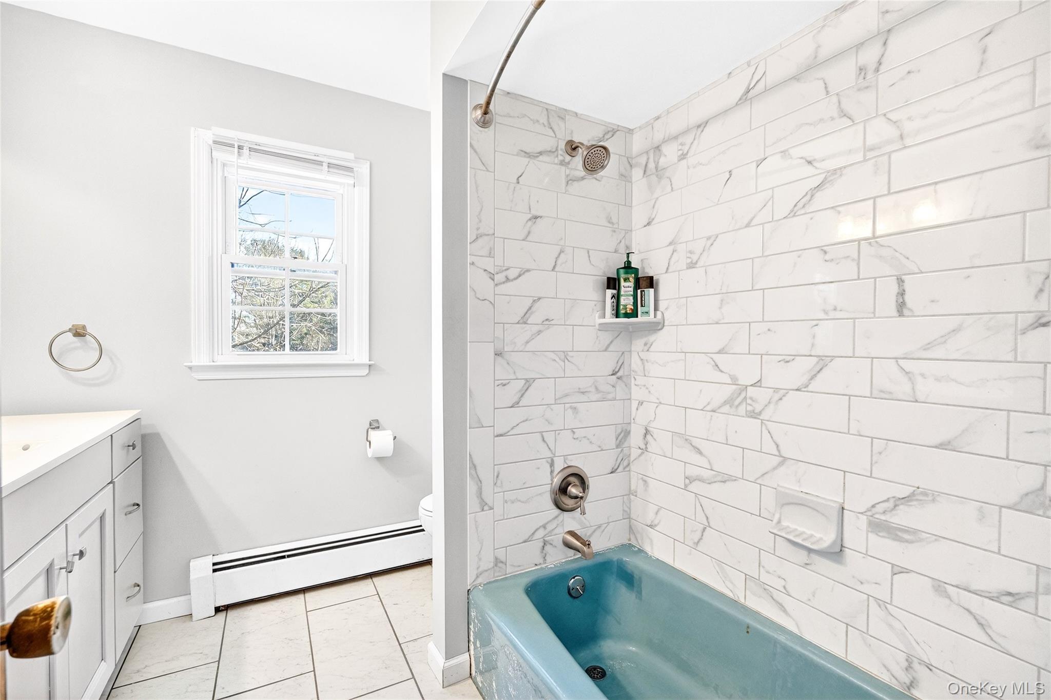 7 O Sullivan Lane Monroe, NY 10950 - Photo 30 of 43 a bathroom with a tub a sink and a shower