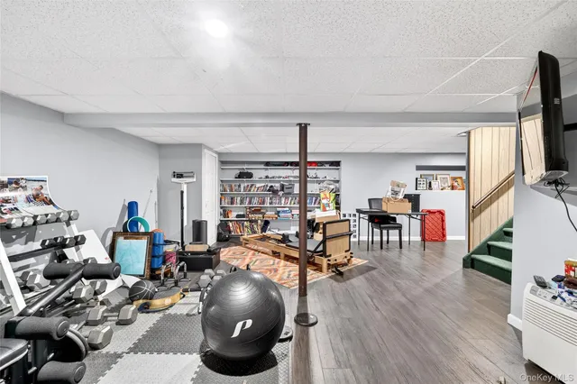 a view of a livingroom with furniture and a flat screen tv