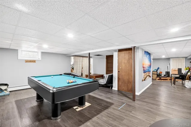 a room with furniture and pool table
