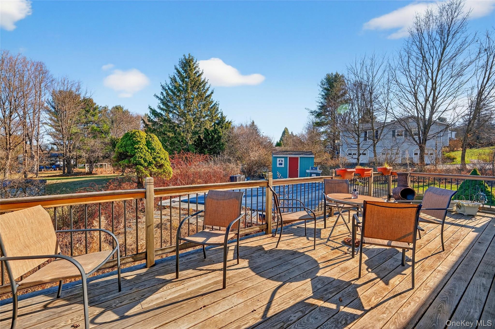 7 O Sullivan Lane Monroe, NY 10950 - Photo 35 of 43 a view of a chairs and table on the deck