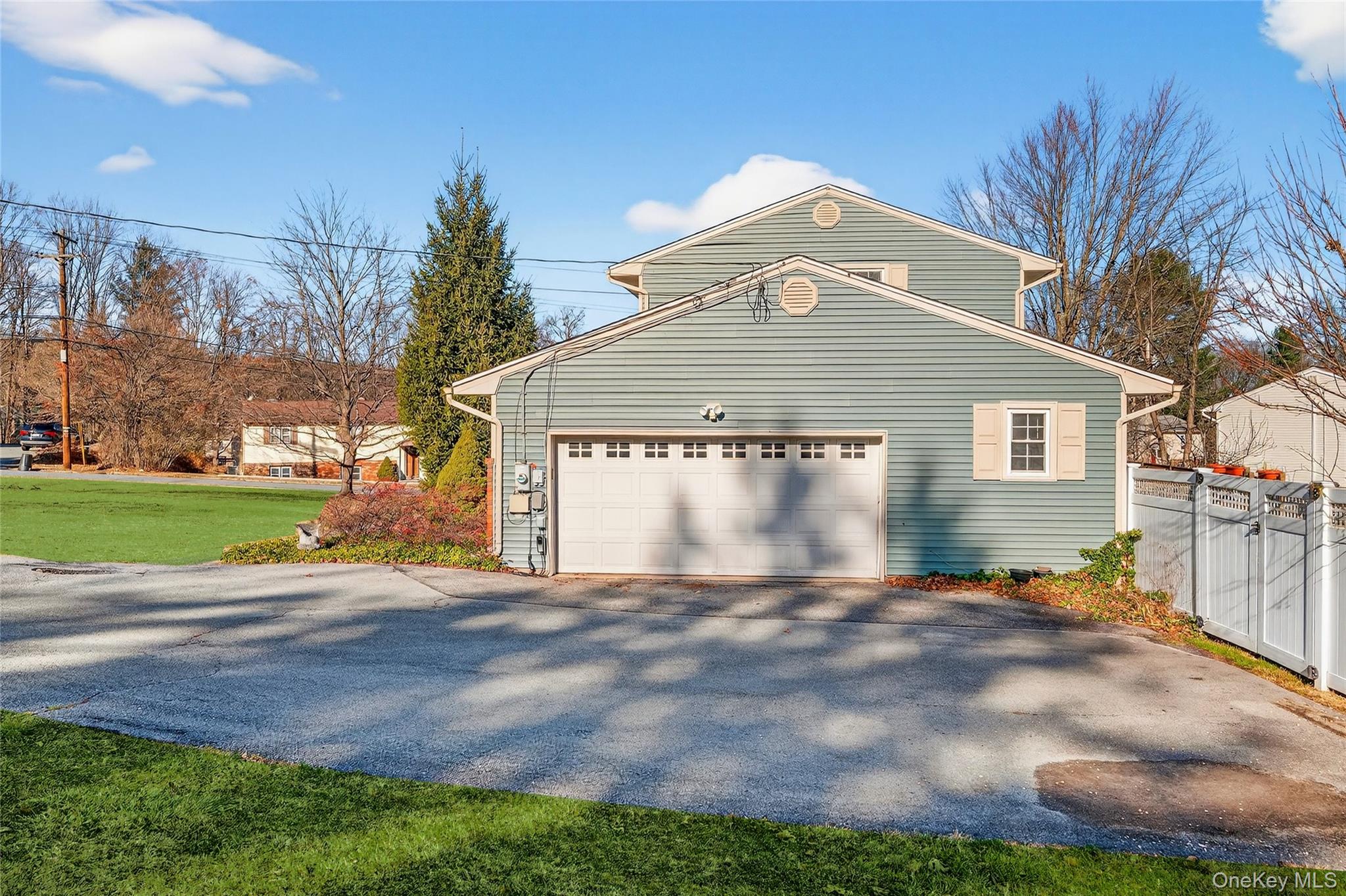 7 O Sullivan Lane Monroe, NY 10950 - Photo 40 of 43 a front view of a house with a yard and garage