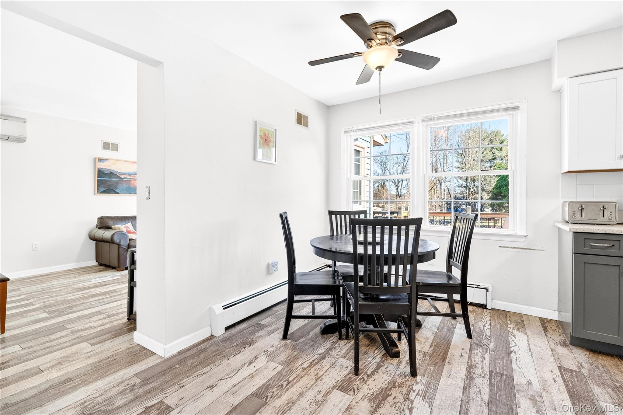 7 O Sullivan Lane Monroe, NY 10950 - Photo 10 of 43 a view of a dining room with furniture window and wooden floor