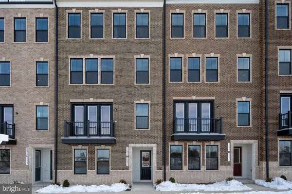 a front view of a building with a lot of windows