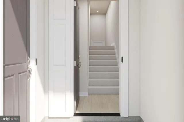 a view of staircase with white walls