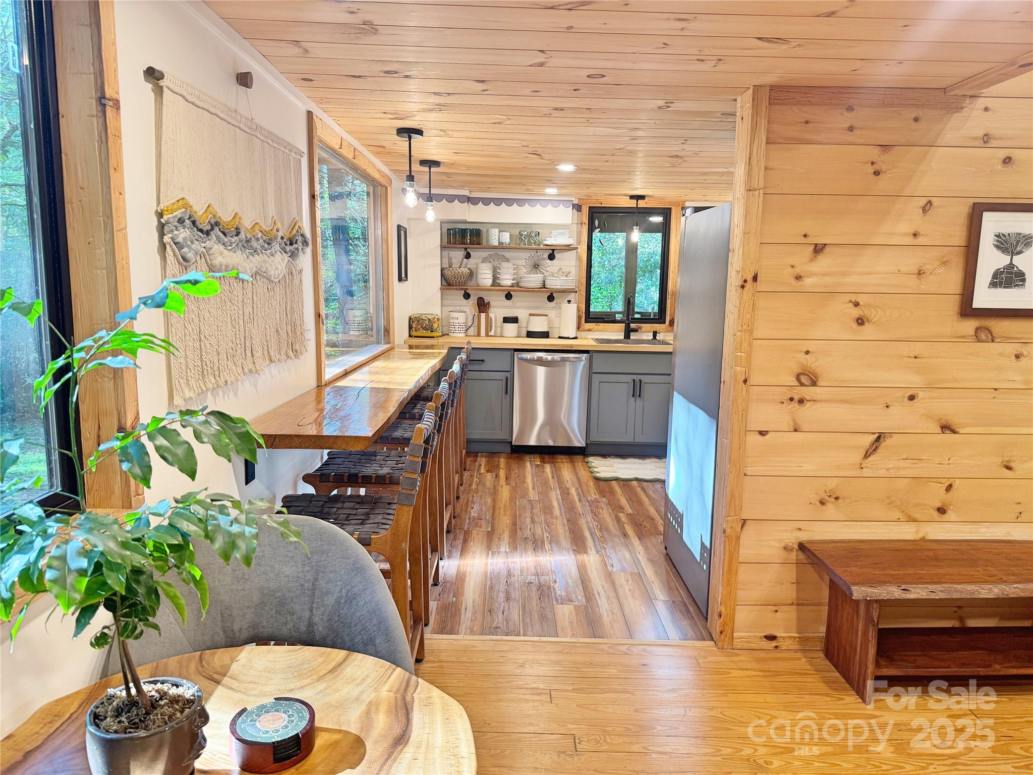 6622 Gingercake Road Newland, NC 28657 - Photo 17 of 48 a dining room with furniture and wooden floor