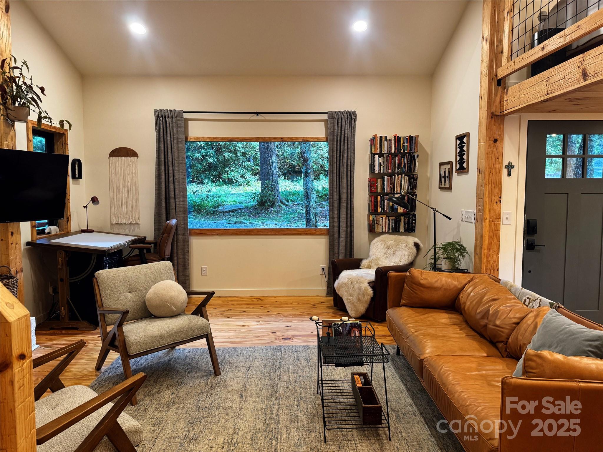 6622 Gingercake Road Newland, NC 28657 - Photo 19 of 48 a living room with furniture a rug and a large window