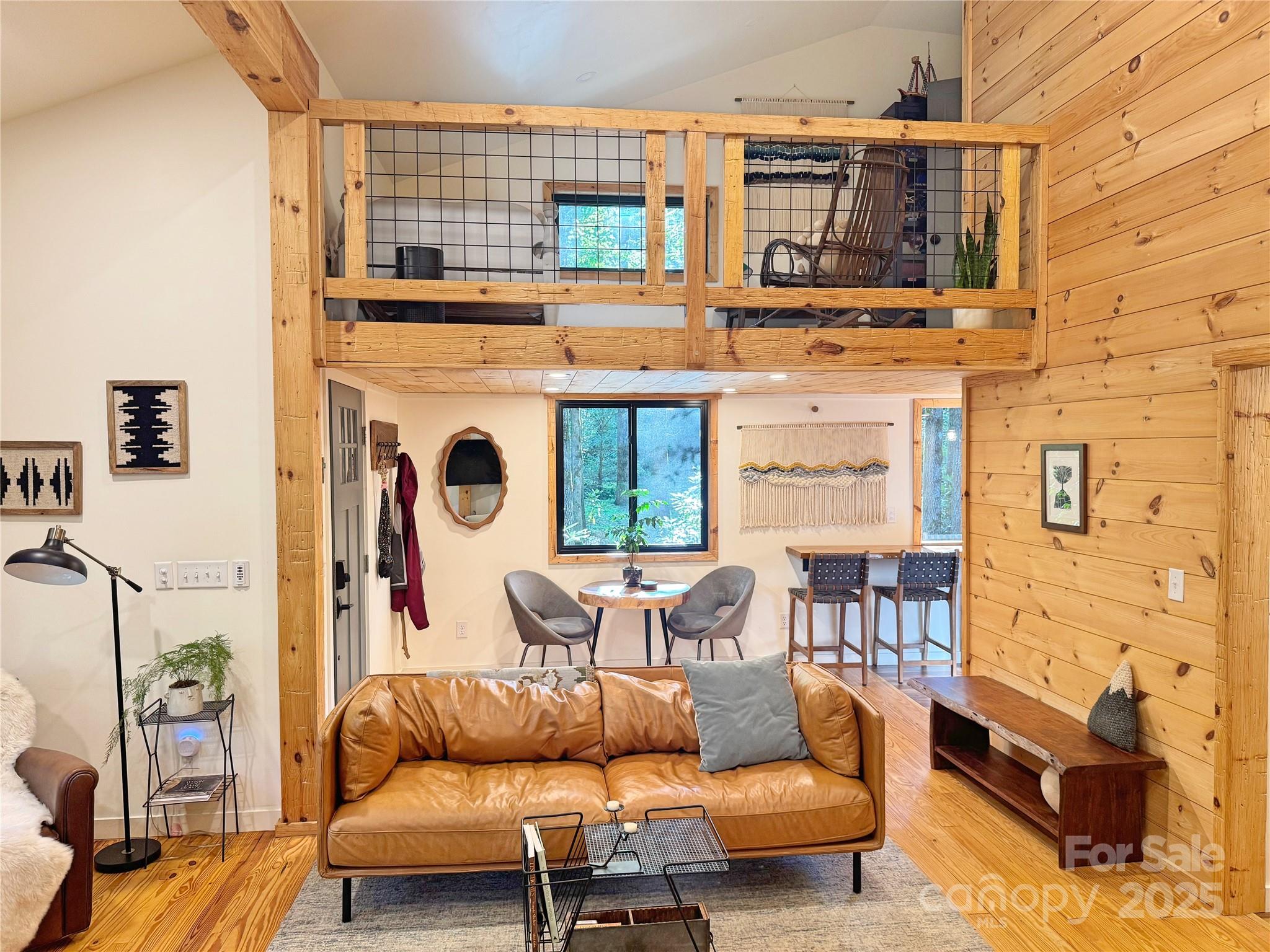 6622 Gingercake Road Newland, NC 28657 - Photo 20 of 48 a living room with furniture wooden floor and a fireplace