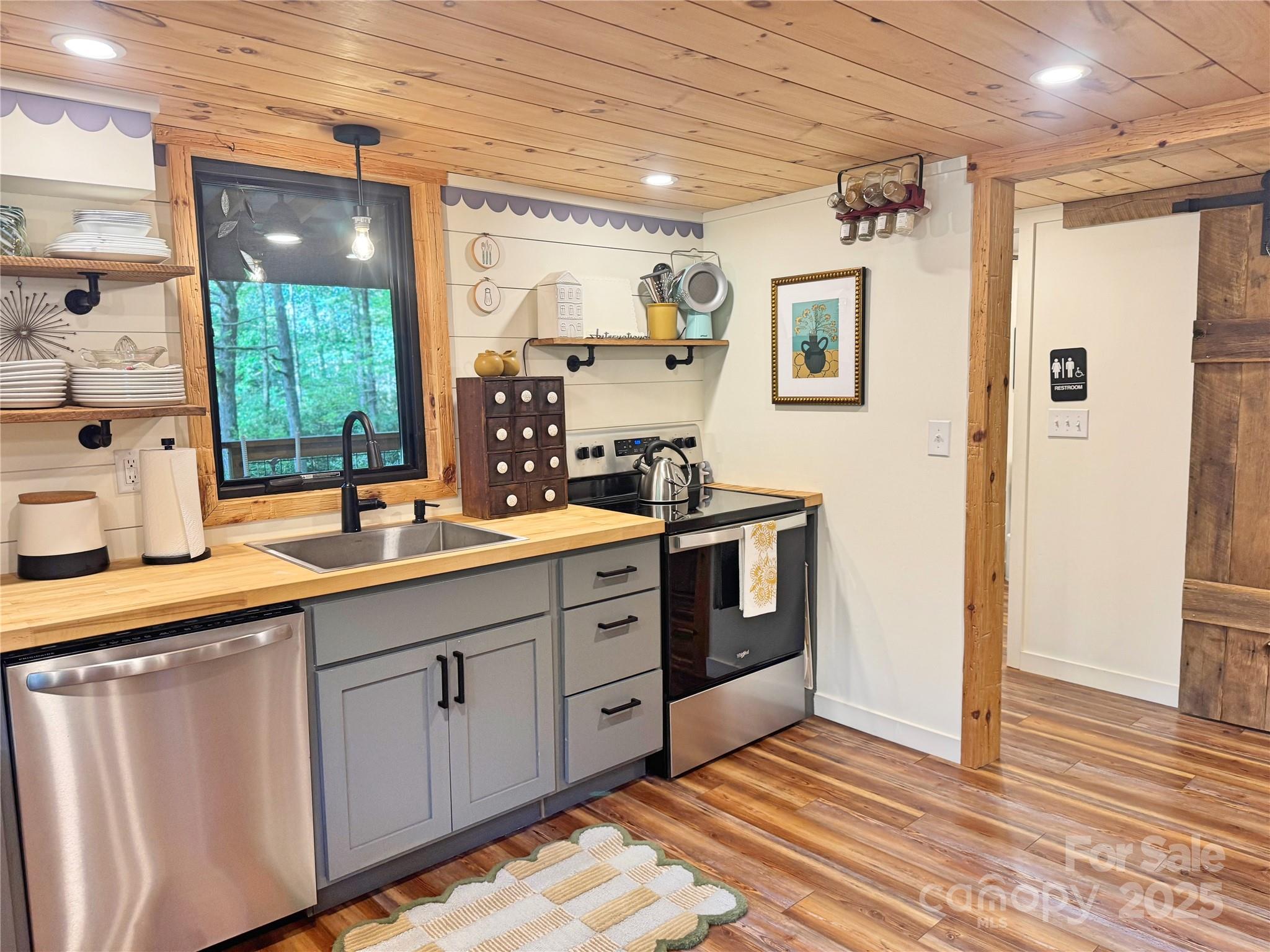 6622 Gingercake Road Newland, NC 28657 - Photo 24 of 48 a spacious bathroom with a double vanity sink a mirror and a shower