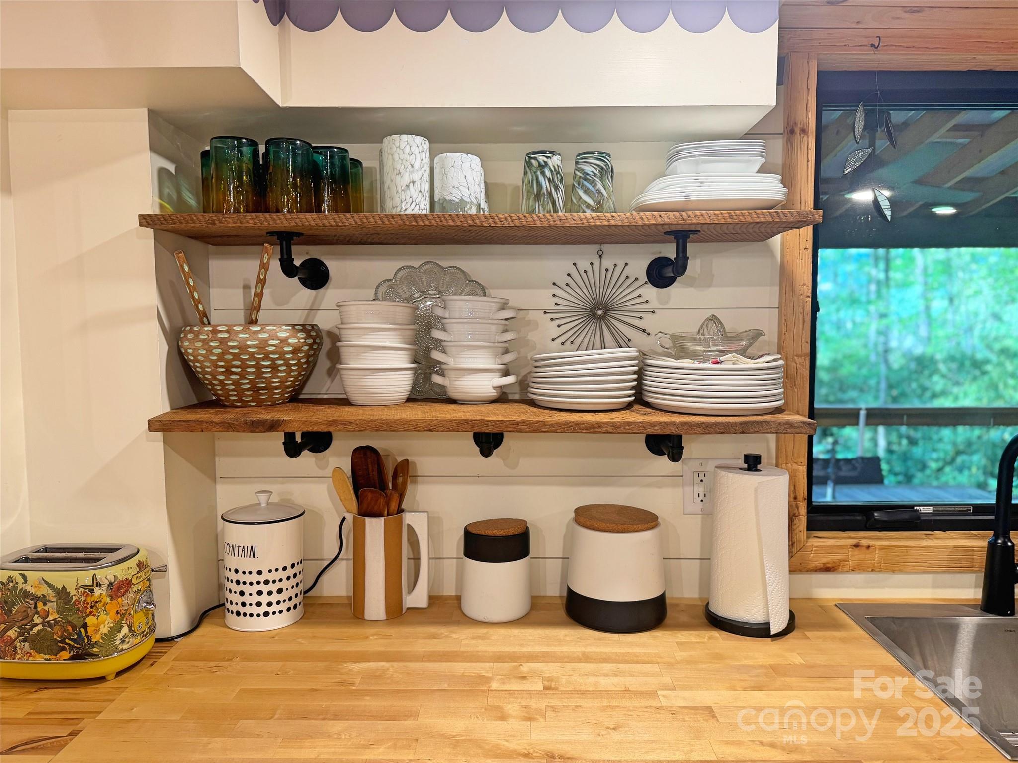 6622 Gingercake Road Newland, NC 28657 - Photo 25 of 48 a table with wine bottles and glasses on it