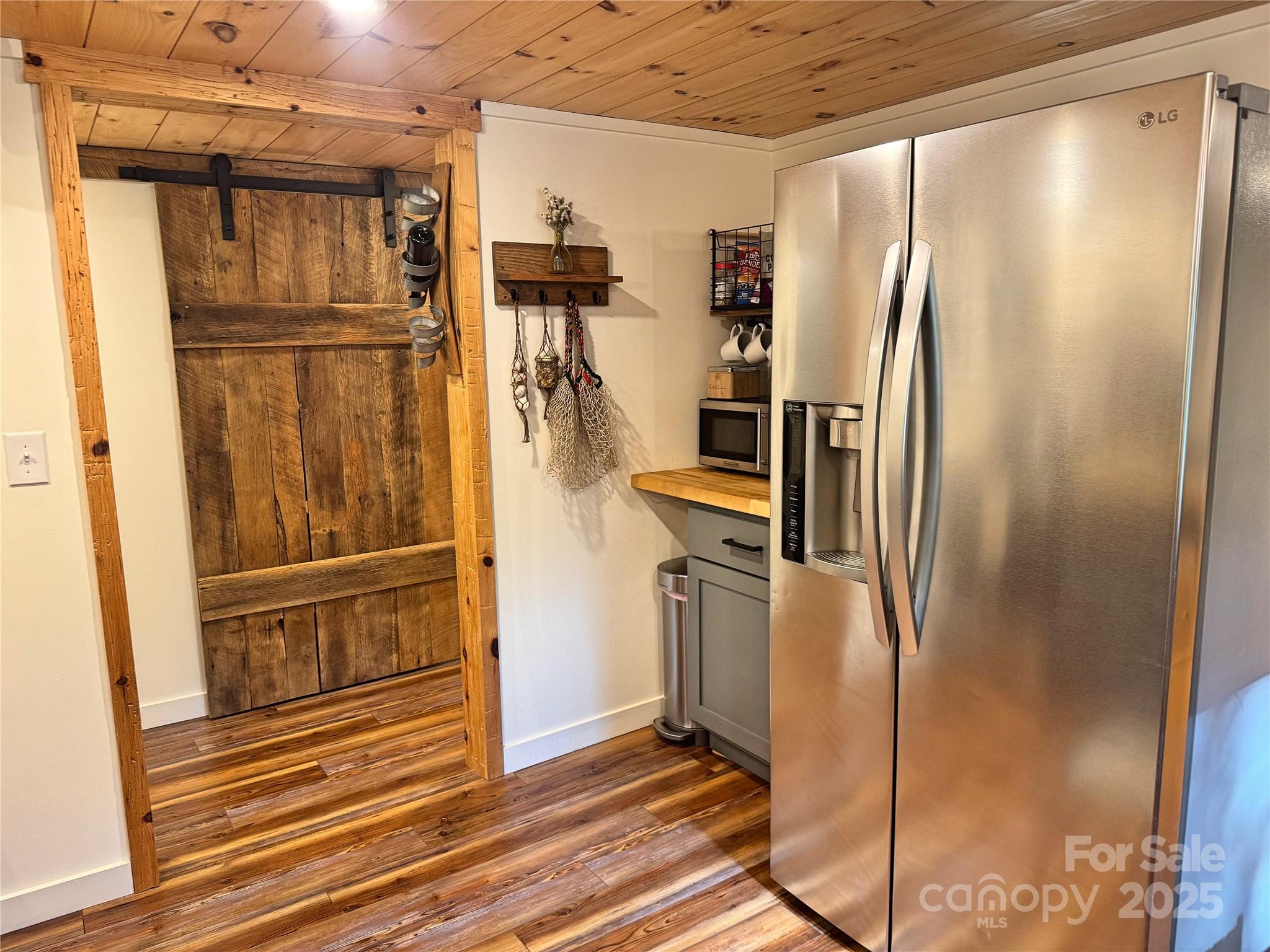 6622 Gingercake Road Newland, NC 28657 - Photo 28 of 48 a view of a refrigerator in kitchen and an empty room