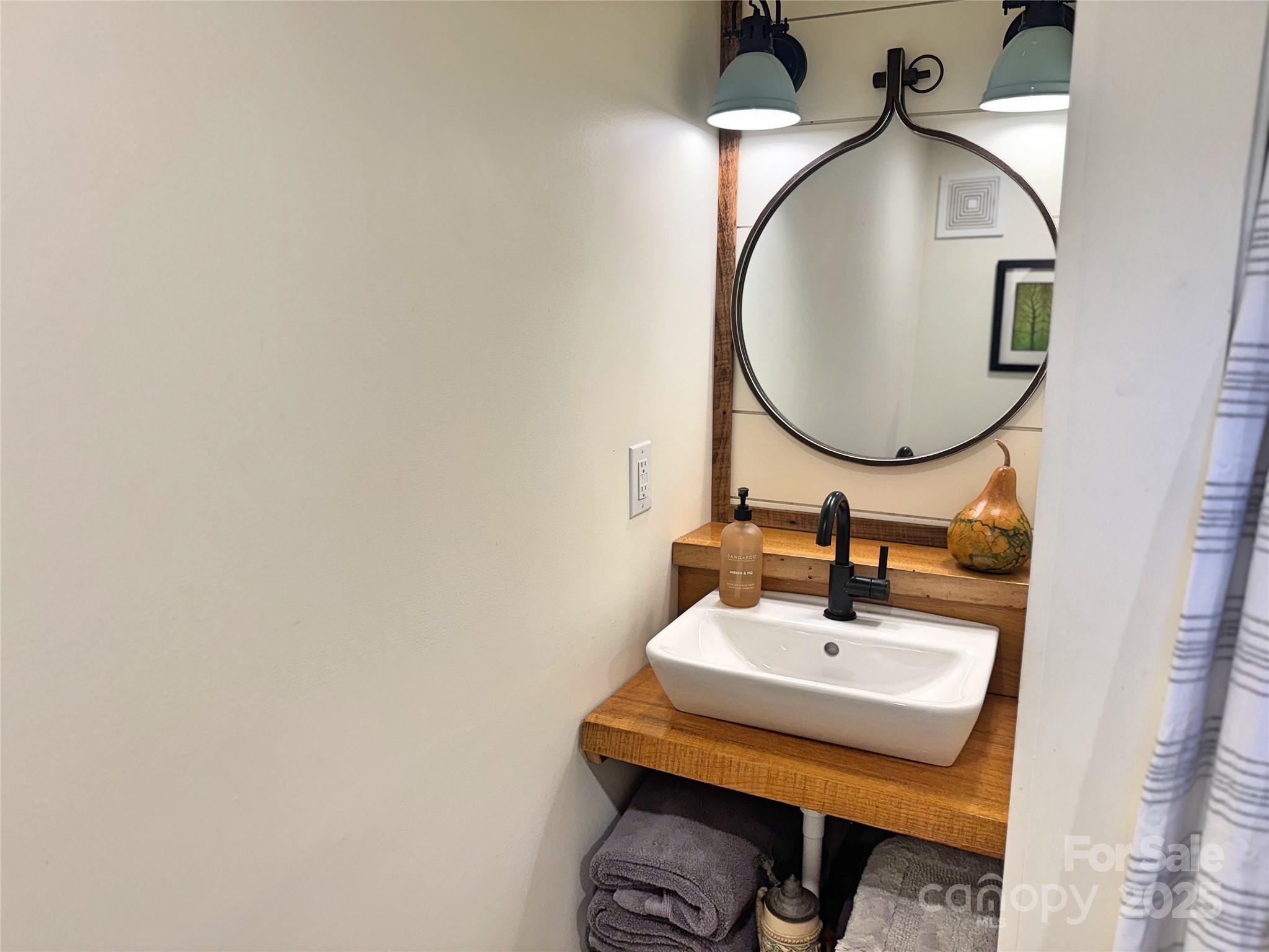 6622 Gingercake Road Newland, NC 28657 - Photo 29 of 48 a bathroom with a sink and a mirror