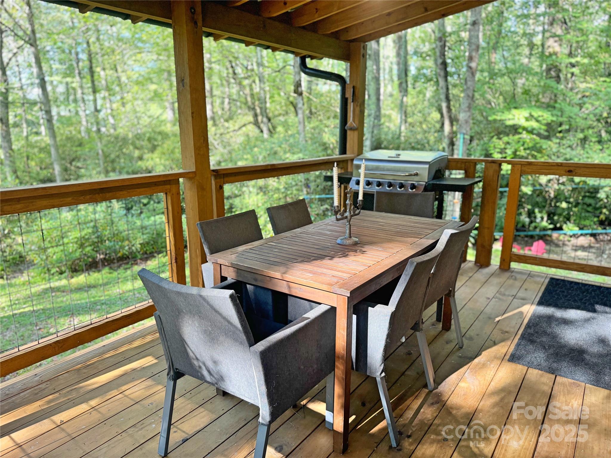 6622 Gingercake Road Newland, NC 28657 - Photo 32 of 48 a view of a dining table and chairs in the patio