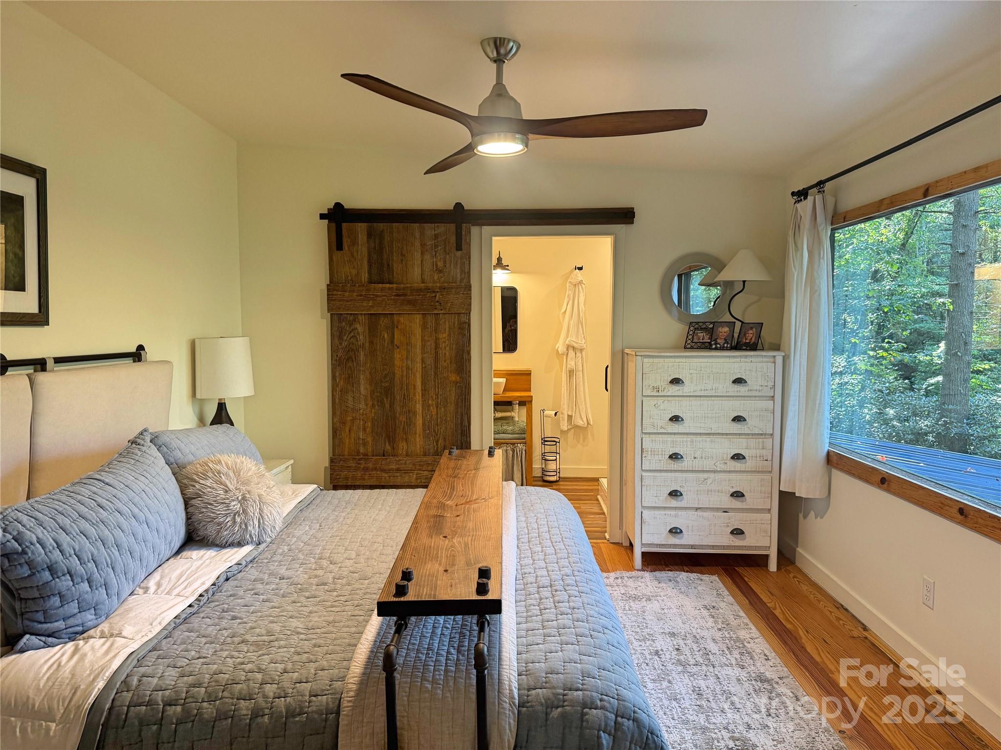 6622 Gingercake Road Newland, NC 28657 - Photo 36 of 48 a bed room with a bed and a window